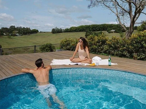 The Haven round plunge pool set against a rural outlook